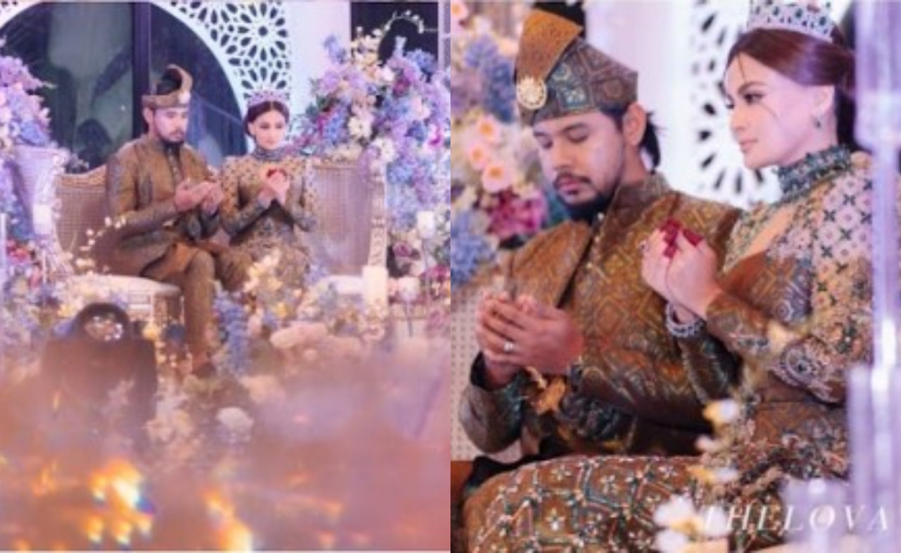 Pasangan raja sehari ini bersanding di atas pelamin.