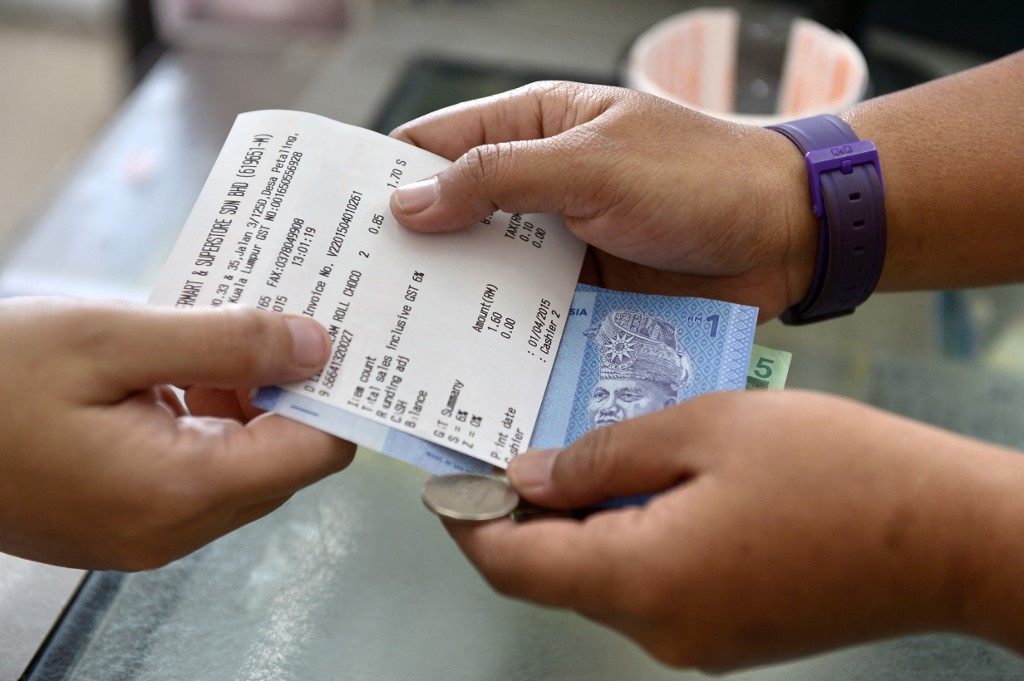 GST iaitu sistem cukai tidak popular, telah diperkenalkan pada 2015. - Gambar AFP 